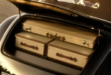 Weekend Getaway luggage in car The History of Travel - EAT LOVE SAVOR International Luxury Lifestyle Magazine