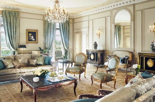 luxury living room with glamorous sofa cozy black cabinet luxuious chandelier lamps and gorgeous blue curtain The "A" List, Gentle Leisure Activities to Slow Down Time EAT LOVE SAVOR International luxury lifestyle magazine and bookazines