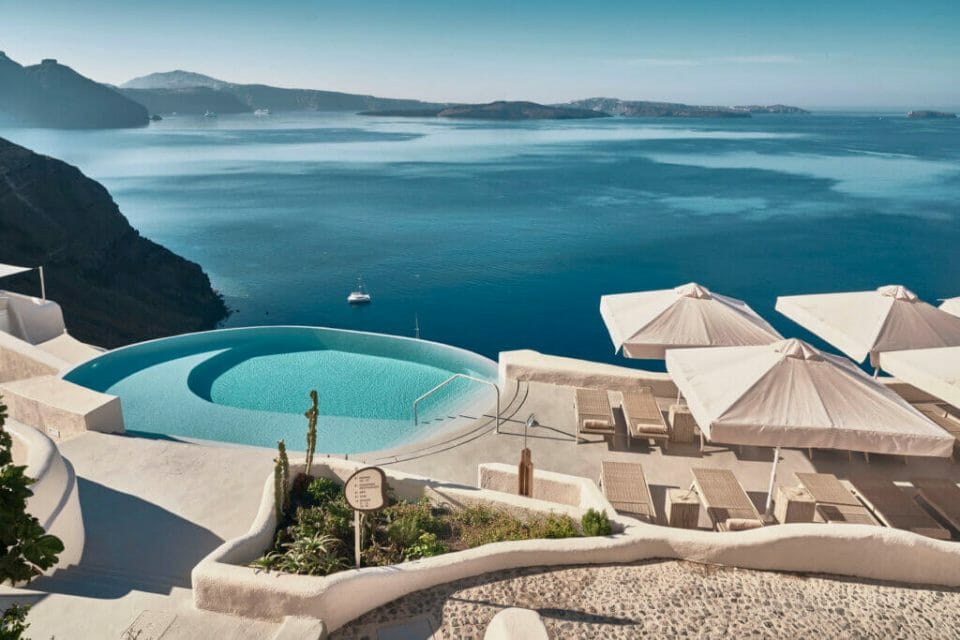 Mystique Hotel infinity pool Discover the Ultimate Greek Escape for 2021: MYSTIQUE, a Luxury Collection Hotel Cut into an Extraordinary Sea Side Landscape - EAT LOVE SAVOR International Luxury Lifestyle Magazine